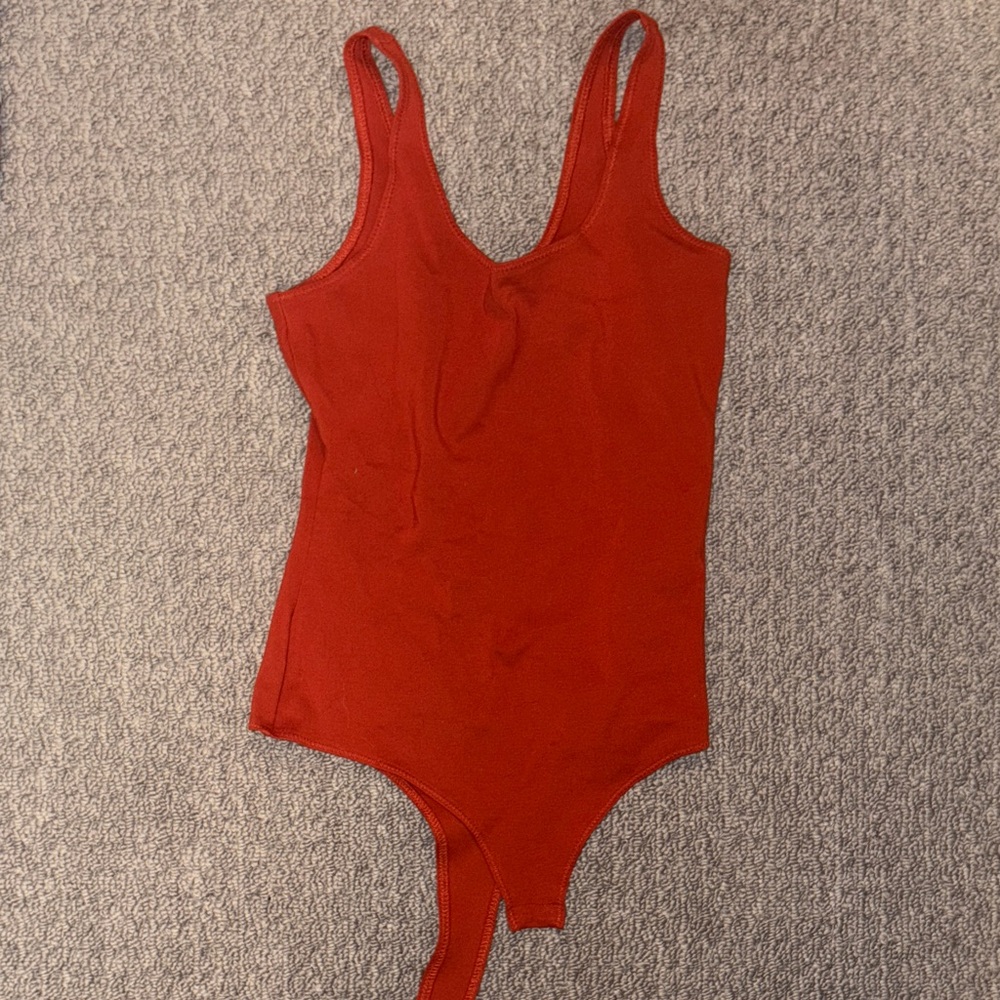 NWOT Stella Luce Burnt Orange Bodysuit